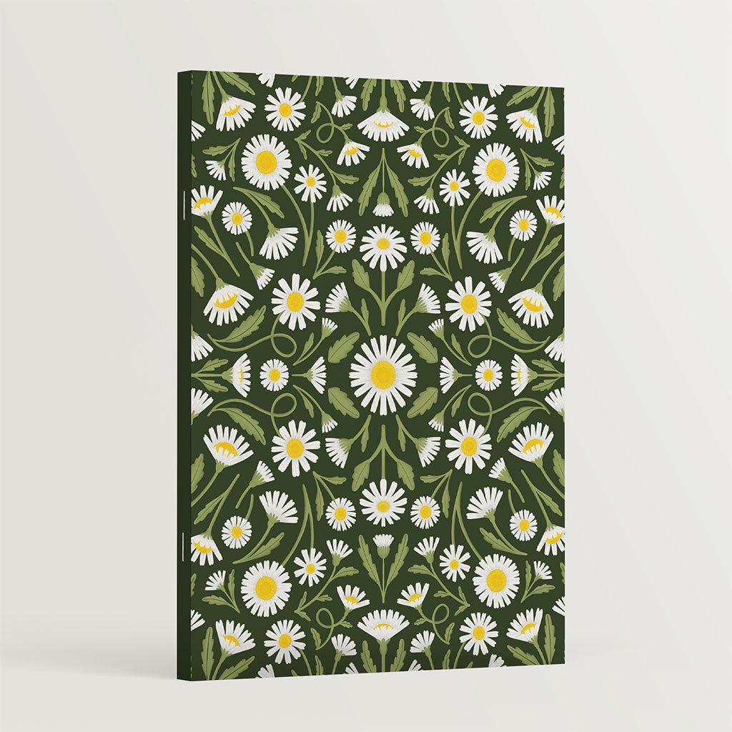 The Heritage Daisies Notebook features a vintage-inspired rectangular cover with white daisies, and green leaves on a dark green background—ideal for floral-themed journaling or creative notes.