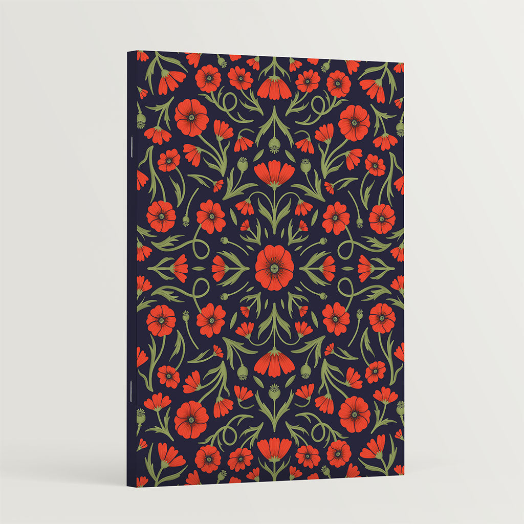 The Heritage Poppies Notebook features a vintage-inspired dark cover with symmetrical red poppies and green leaves, perfect for journaling.