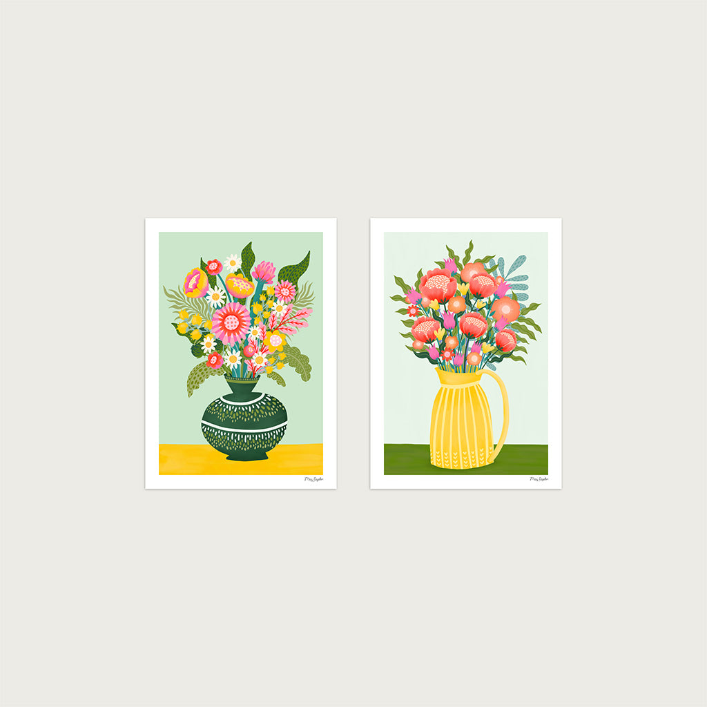 The Flower Vases x2 Art Print Set features two vibrant floral prints—bouquets in a green vase on the left and a yellow pitcher on the right—set against light backgrounds, perfect for art and flower lovers.