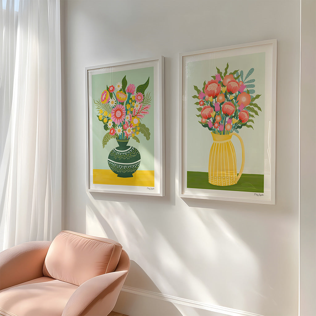 The Flower Vases x2 Art Print Set features two vibrant floral prints—bouquets in a green vase on the left and a yellow pitcher on the right—set against light backgrounds, perfect for art and flower lovers.