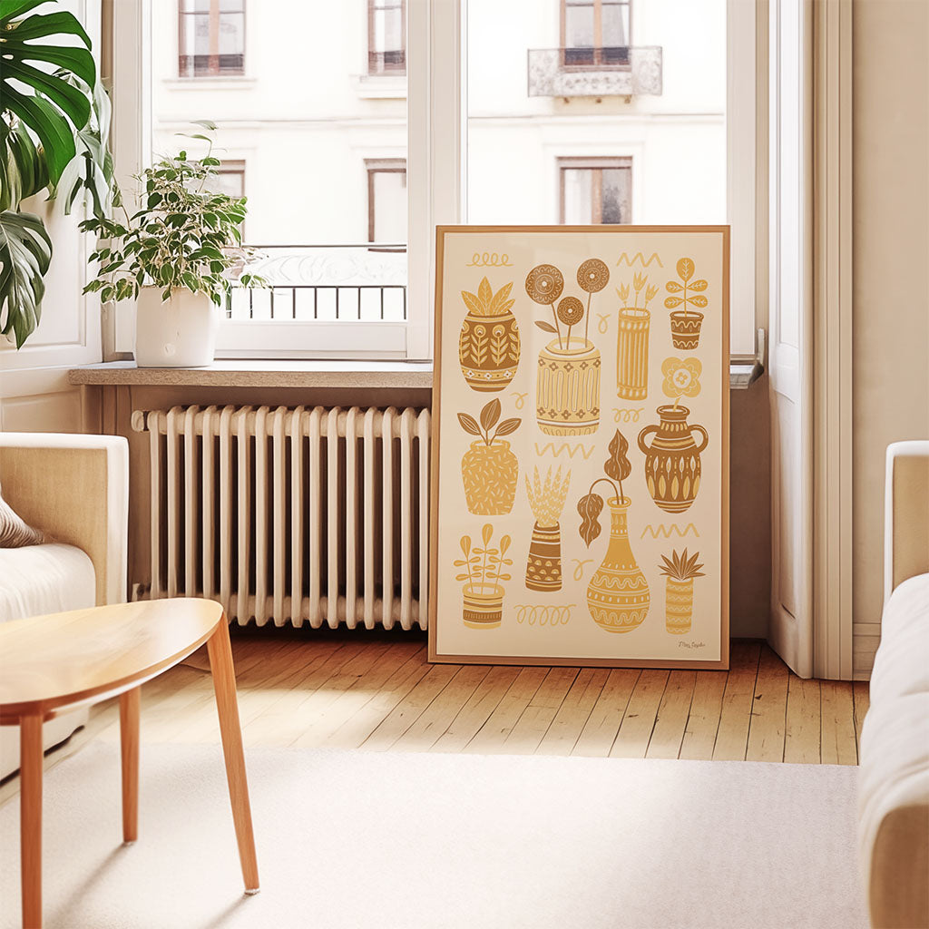 Yellow Pots & Plants Art Print features retro ceramics and vibrant yellow and orange potted plants arranged in a grid on a cream background—ideal for house plant lovers.