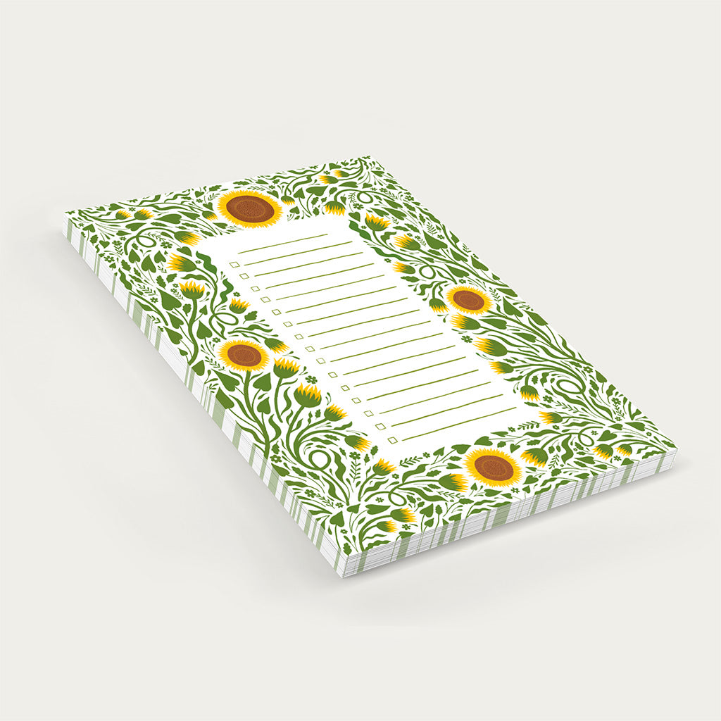 The Sunflowers Floral Notepad is a rectangular checklist pad with a sunflower and green leaf border, blank lines, and checkboxes, ideal for organising your daily tasks in style.