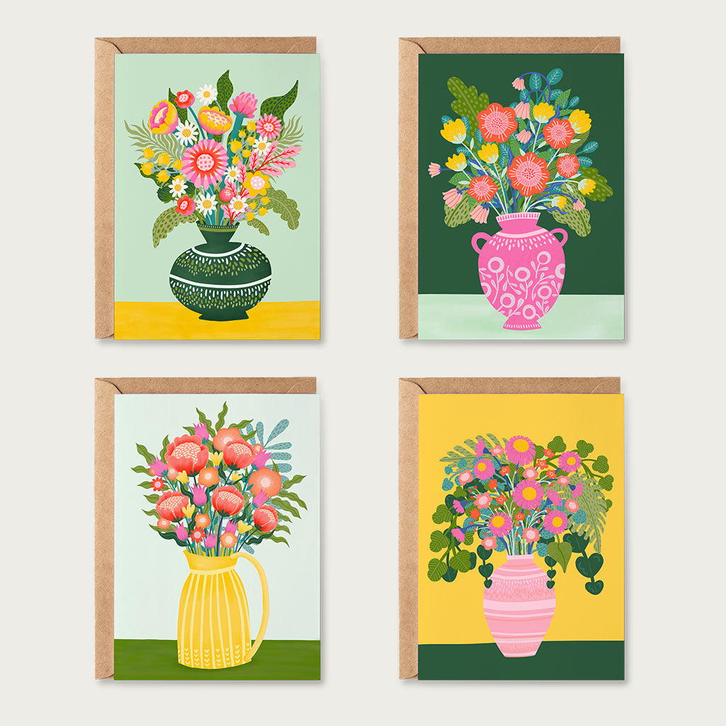 The Flowers in Vases Greetings Card Set includes four retro cards with colourful illustrated flower arrangements in vintage vases and pitchers, each set against a unique background colour.