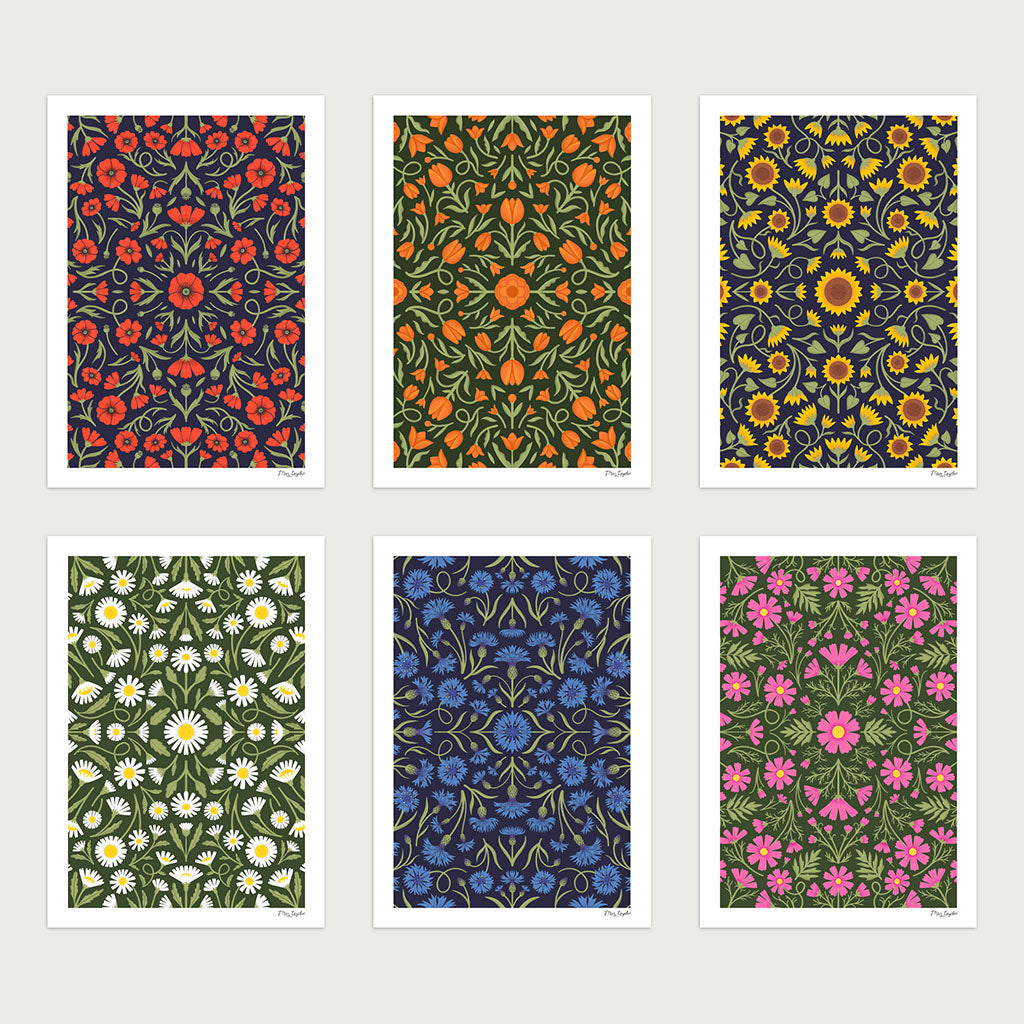 The Heritage set of six art prints features art with vibrant, symmetrical floral patterns in red, orange, yellow, white, blue, green, and pink—ideal for creating a striking botanical gallery wall.