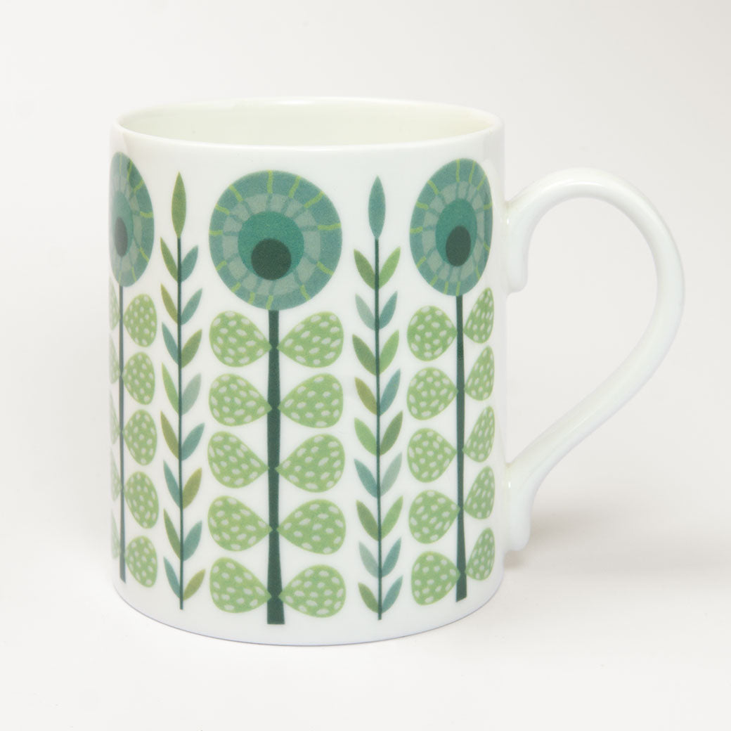The Vintage Dark Green Mug is a fine bone china mug with a handle, featuring green and blue geometric floral patterns for retro charm—ideal for anyone looking to add vintage style to their kitchen.